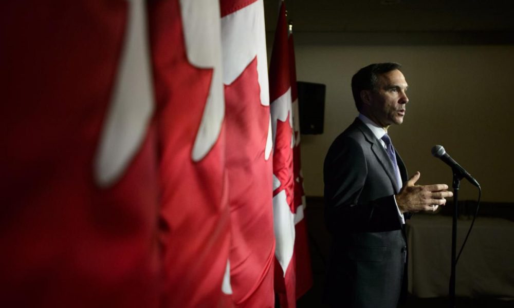 Finance Minister says corporate tax breaks needed to stop Canada losing business dollars to U.S.