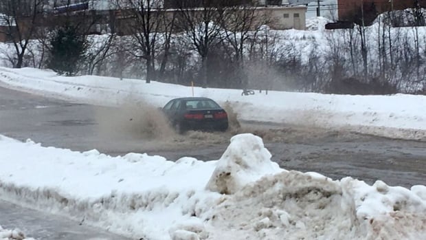 Flash flooding, power outages, school closures hit NB